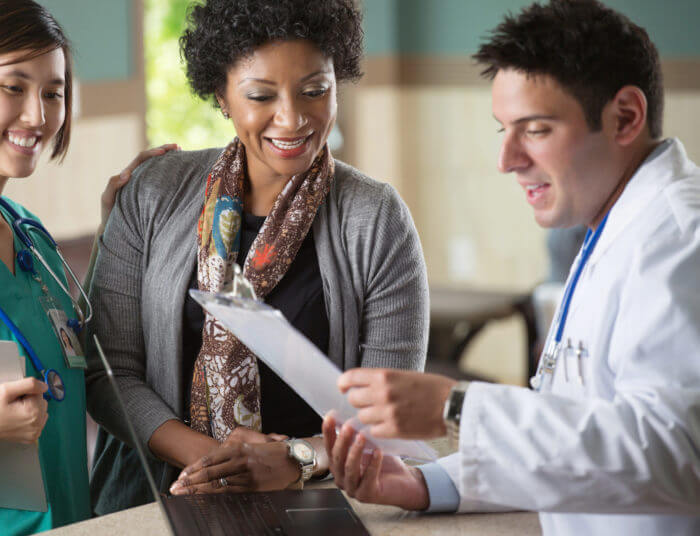 healthcare-financing-doctor-discussing-paperwork-with-patient